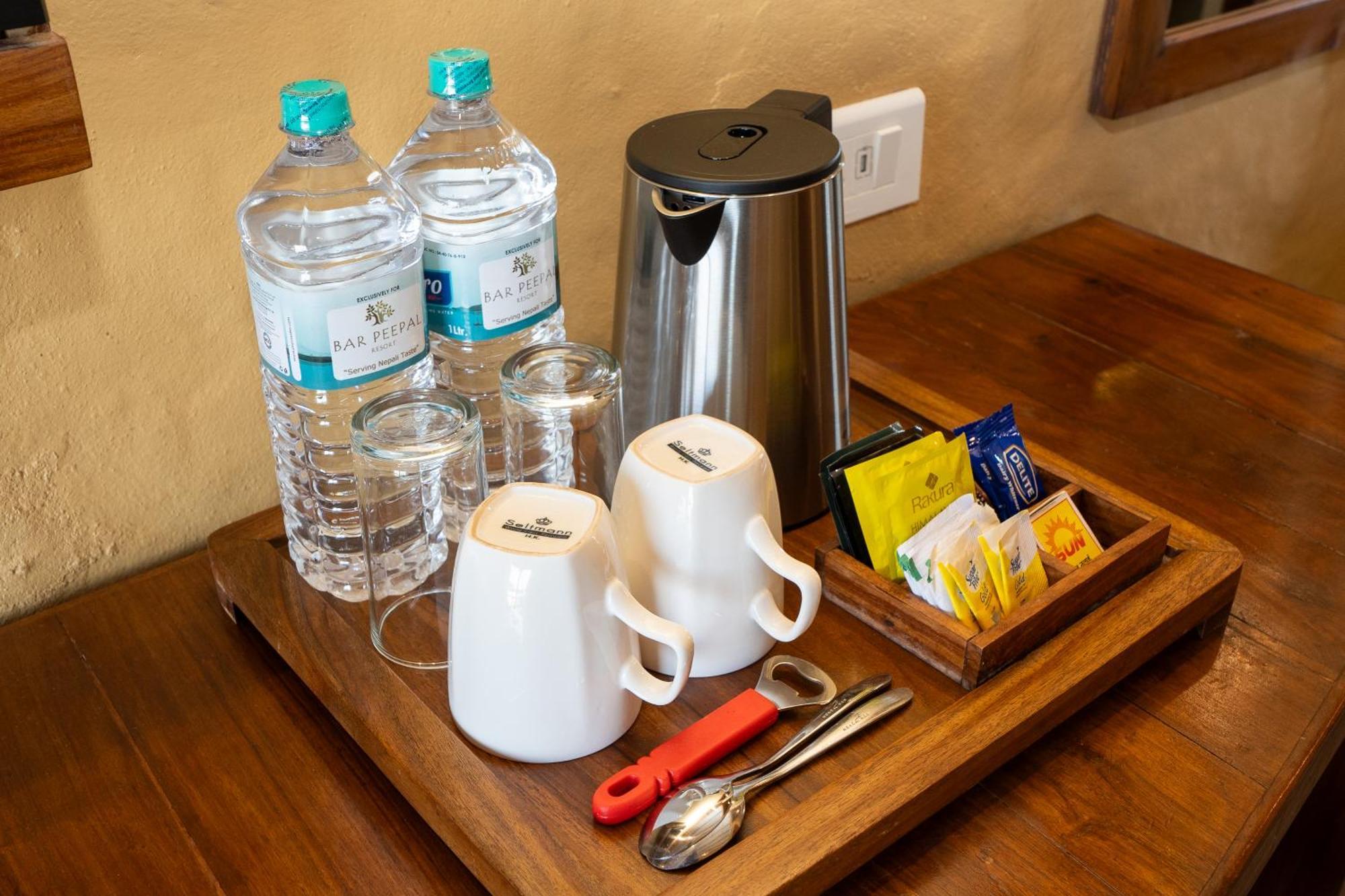 Bar Peepal Resort Pokhara Dış mekan fotoğraf A tea tray